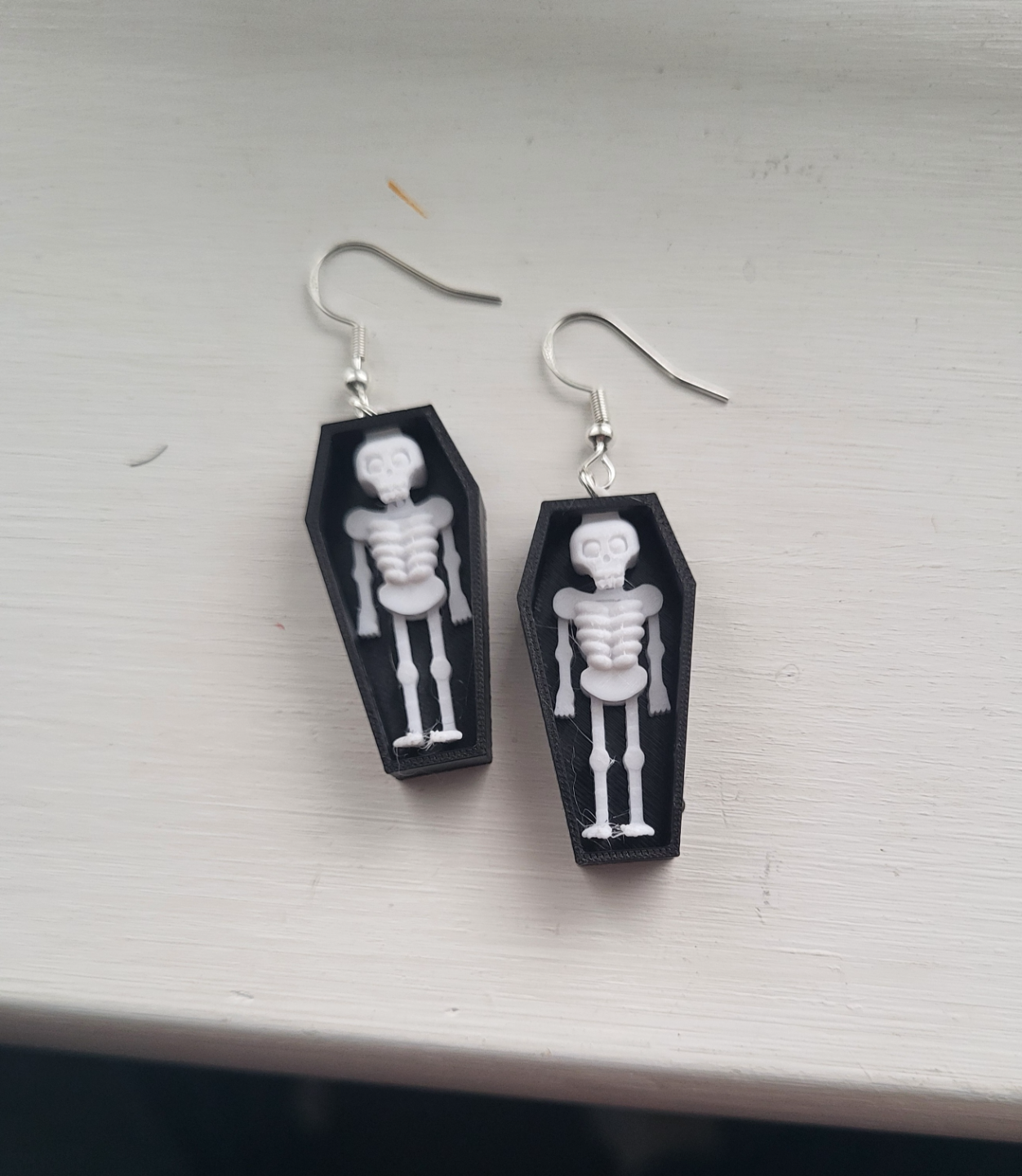 skelton in coffin earring